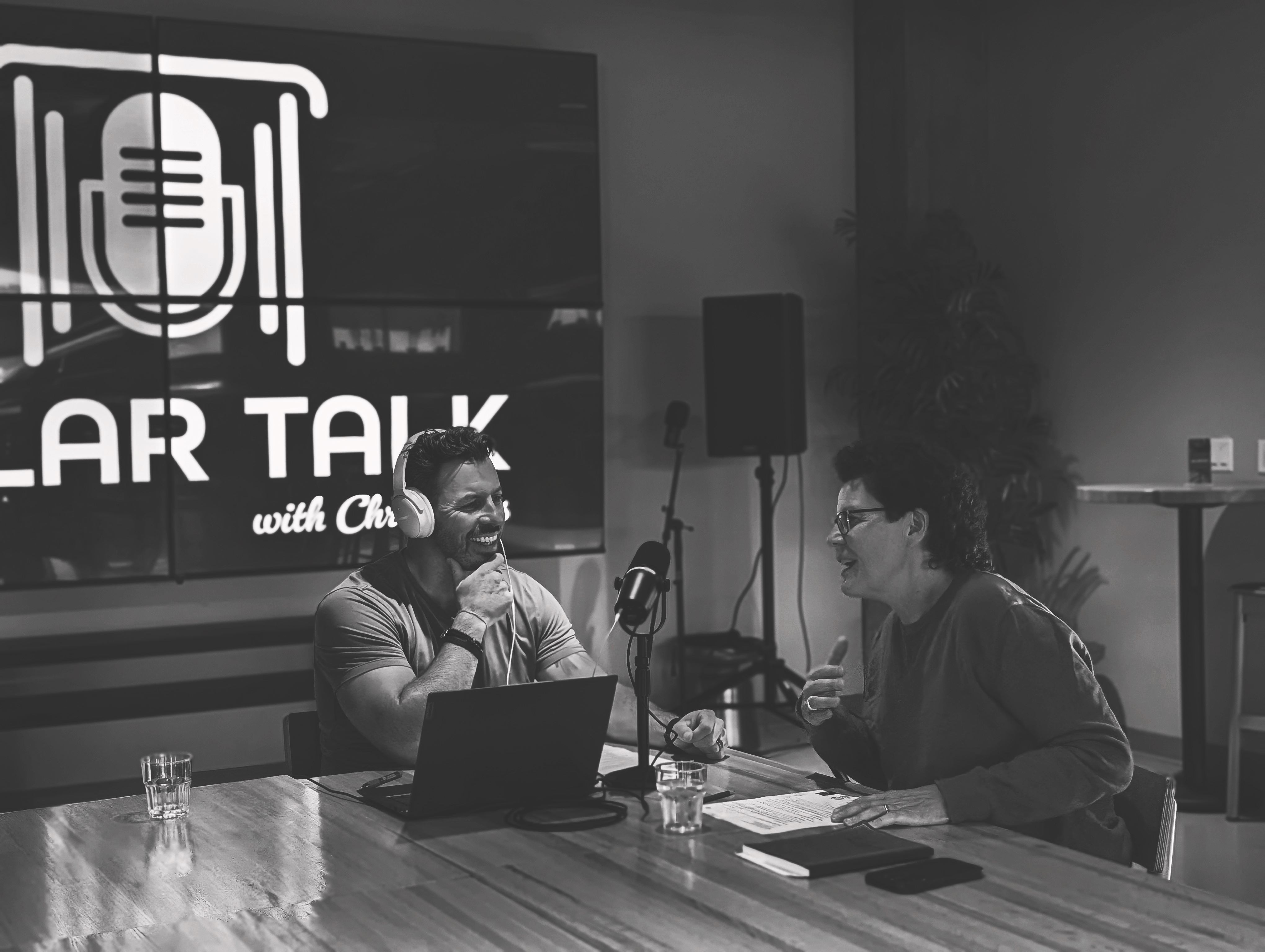 Julie and Chris recording the podcast episode in a cafe